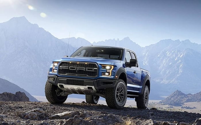 Blue Ford F 150 parked in the mountains, showcasing how good an F 150 looks.