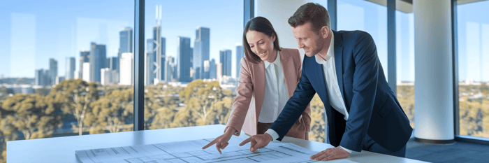 Two professionals collaborating over a strategic plan.