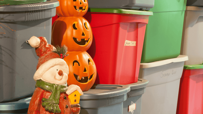 Holiday decorations and seasonal items arranged in colorful storage bins