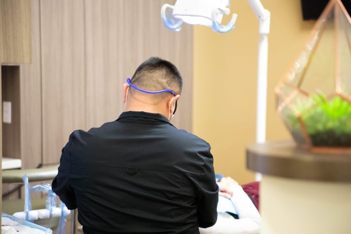 A dentist working on a patient