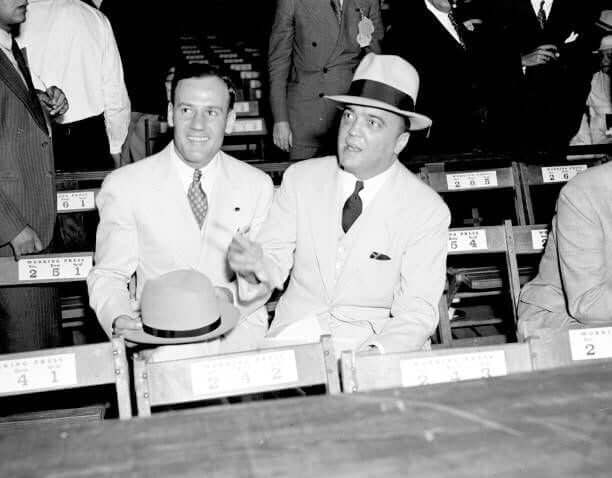 Edgar Hoover and Clyde Tolson attending the Joe Louis - Jack Sharkey fight at Yankee Stadium.