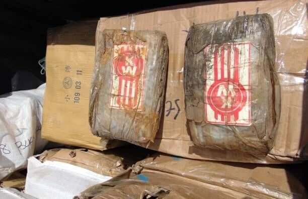 Photo on December 15, 2020 shows a box filled with one-kilo "bricks" of cocaine after a transfer to a police pickup truck from a patrol vessel that...