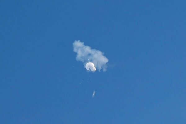 Deflating spy balloon mid-air