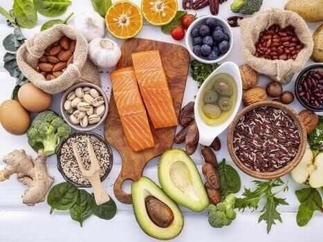 Salmon and other fresh foods on white wood photo Salmon and other fresh foods on white wood photo