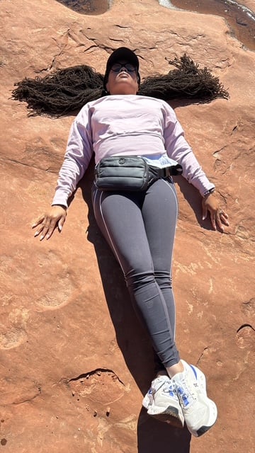 Locs in the desert air of Sedona during a grounding experience in nature. 