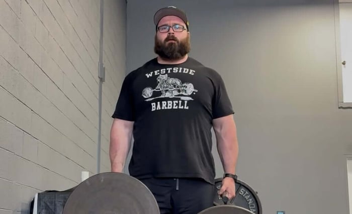 Athlete performing farmer's walk.
