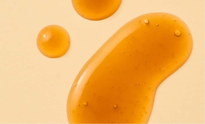 Golden self tan drops with smooth texture showing natural bronzing formula for sensitive skin