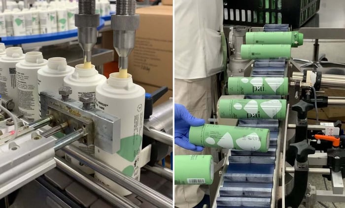 Pai Skincare production line with white tubes being filled and green product boxes being labeled on manufacturing equipment