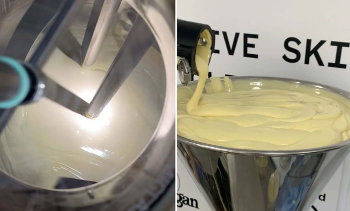 Professional laboratory mixing equipment creating smooth yellow body cream emulsion during skincare formulation development