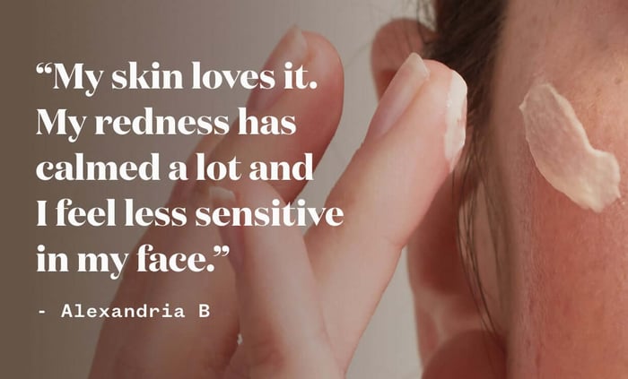 Woman applying sensitive skin face cream with gentle hands, natural lighting highlighting calm complexion