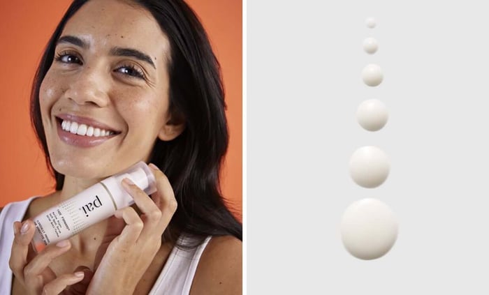 Woman smiling while holding Pai Fade Forward dark spot serum against orange background, with product texture drops shown
