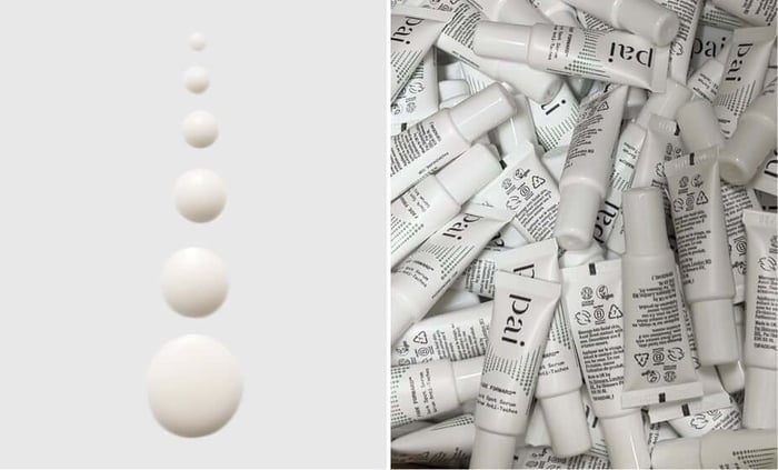 Multiple white tubes of Pai Fade Forward dark spot serum with visible product information and branding scattered across surface