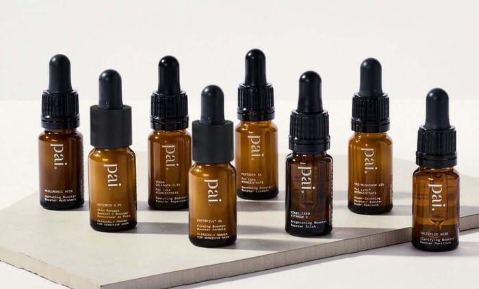 Collection of Pai Skincare booster serums in amber glass bottles for treating hyperpigmentation and uneven skin tone