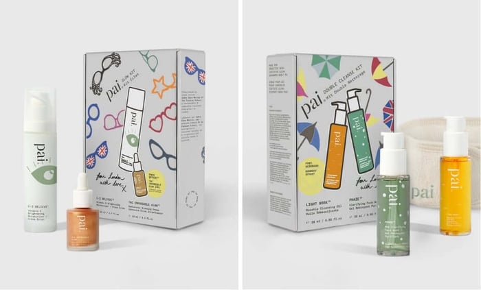 Two Pai Skincare holiday gift sets featuring colorful illustrated packaging with hand-drawn doodles and Union Jack flags