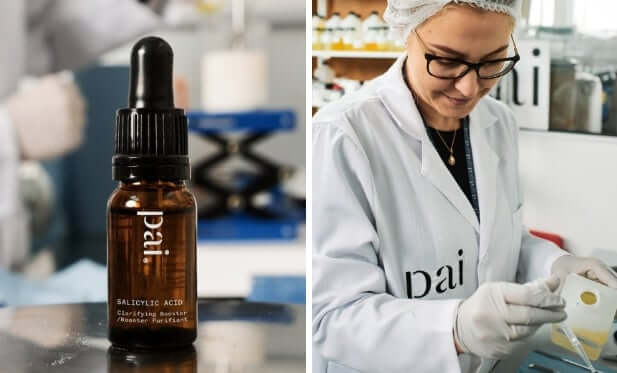 Pai Salicylic Acid booster bottle in laboratory setting alongside scientist in white coat working at research bench
