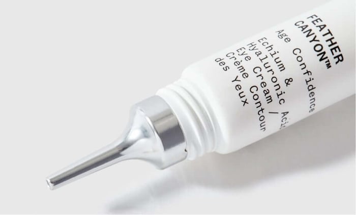 Feather Canyon eye cream tube with precision tip applicator on white background