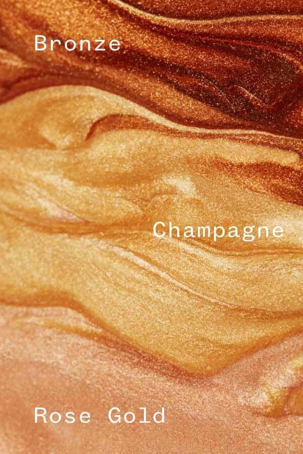 Three shimmery glow drop swatches in Bronze, Champagne and Rose Gold shades for sensitive skin