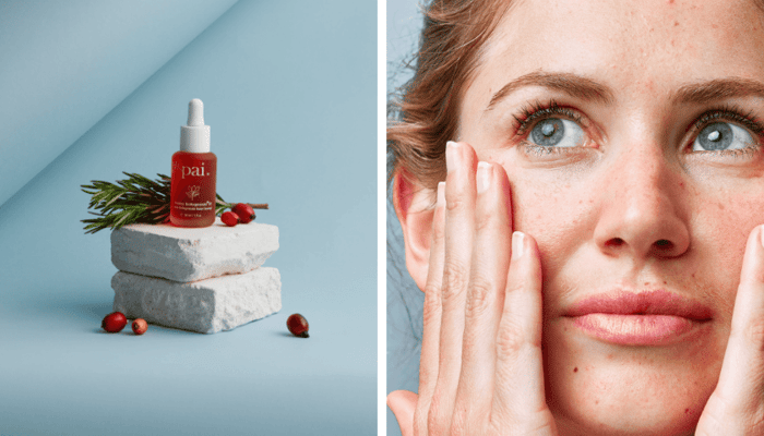 Pai Rosehip BioRegenerate Oil bottle displayed on white marble blocks with cranberries and rosemary, alongside close-up of woman applying skincare to face