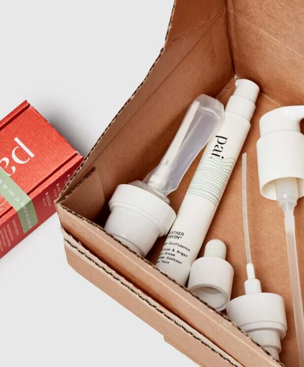 Pai skincare products in recyclable cardboard packaging with white pump bottles and tubes