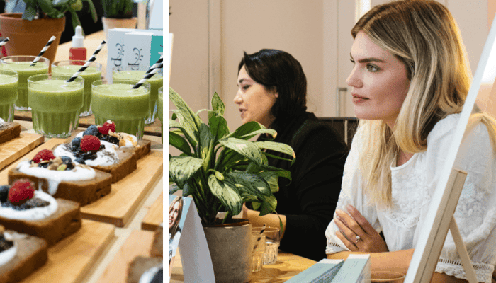 Nutritionist Frances Phillips working at desk with green smoothies and healthy breakfast spread featuring berries and yogurt