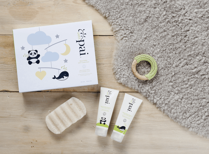 Pai baby skincare gift set with white packaging, konjac sponge, and two gentle body wash tubes with panda and whale illustrations
