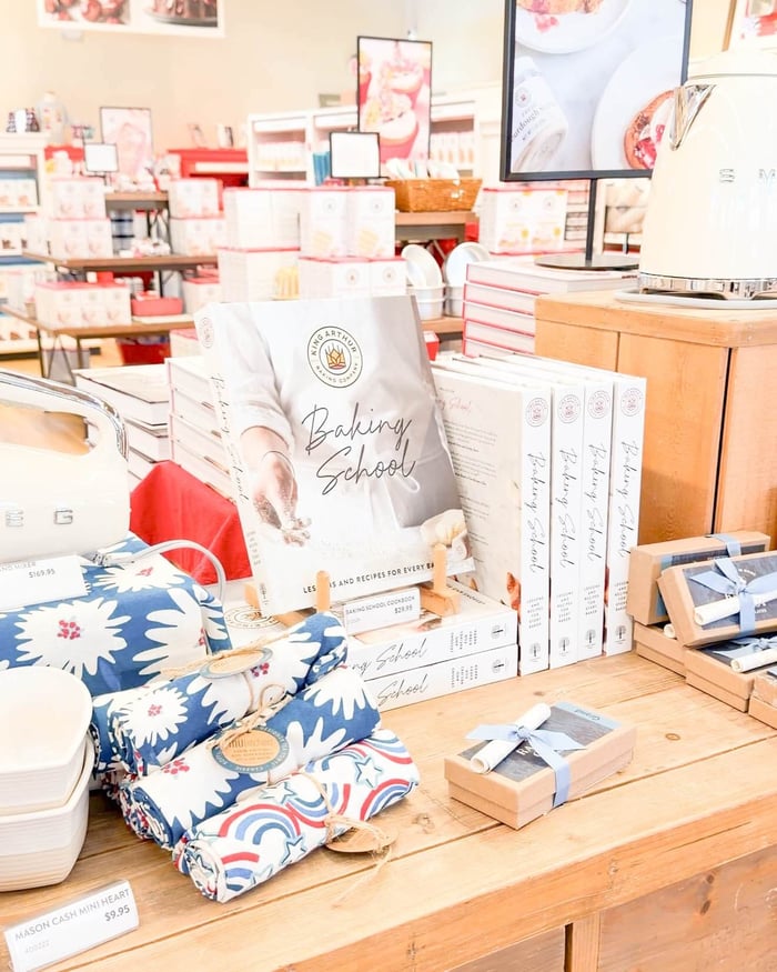 a countertop filled with cookbooks and other baking essentials