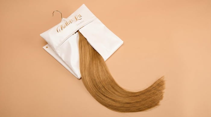 Bella-Lu hair extensions stored smoothly inside the Bella-Lu hair extensions carrier bag.