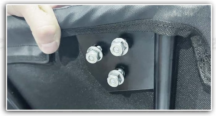 Three hinge bolts seated through the door textile