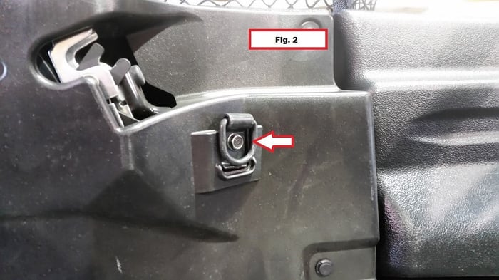 Removing the 10mm bolt holding the D-ring on the side panel