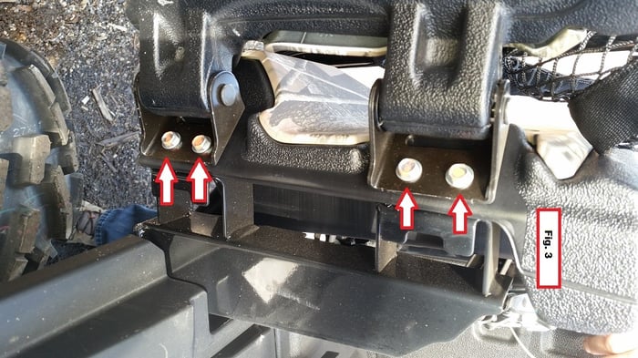 The four bolts holding the rear door on a Honda Pioneer 1000-6