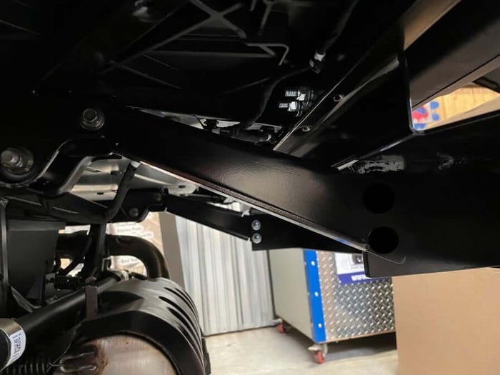 Underside view of the bracket mounted to the frame on a Ranger SP 570