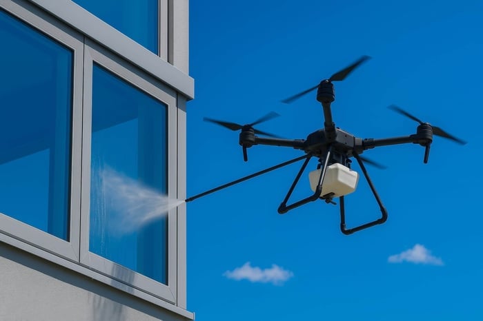 drone cleaning building with chemicals