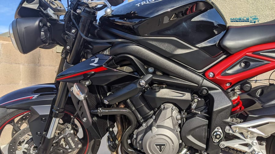 Ceramic coating on Triumph motorcycle in San Diego - professional paint protection for all vehicles