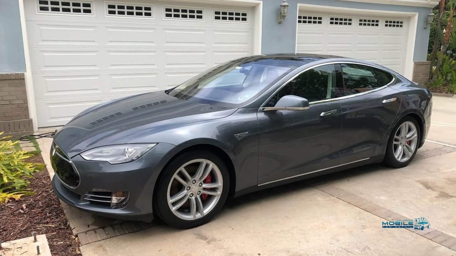 Professional car detailing for a Tesla sedan in San Diego — showcasing the exterior finish of a standard detail package.