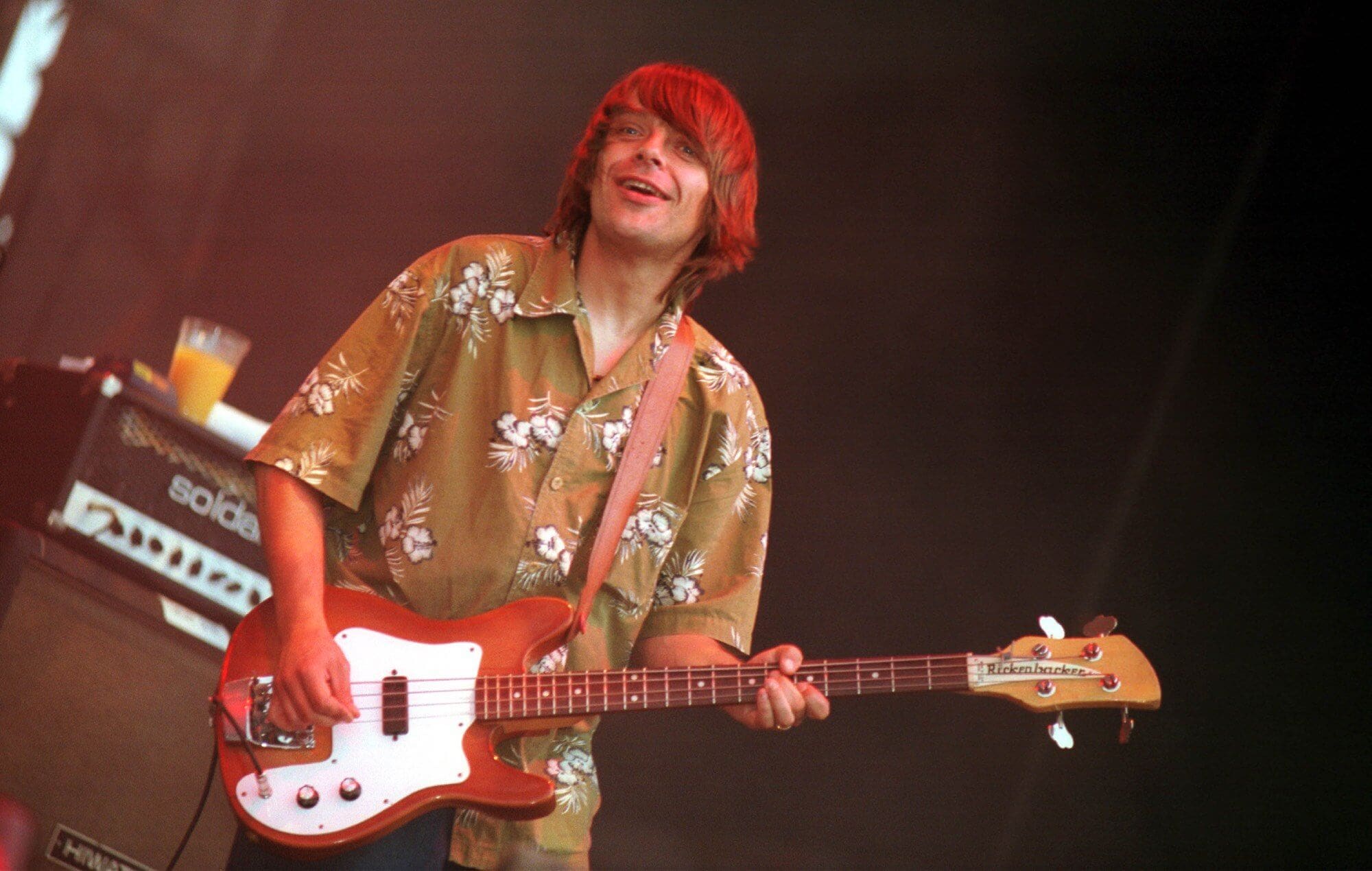 Mani performing live onstage with Primal Scream