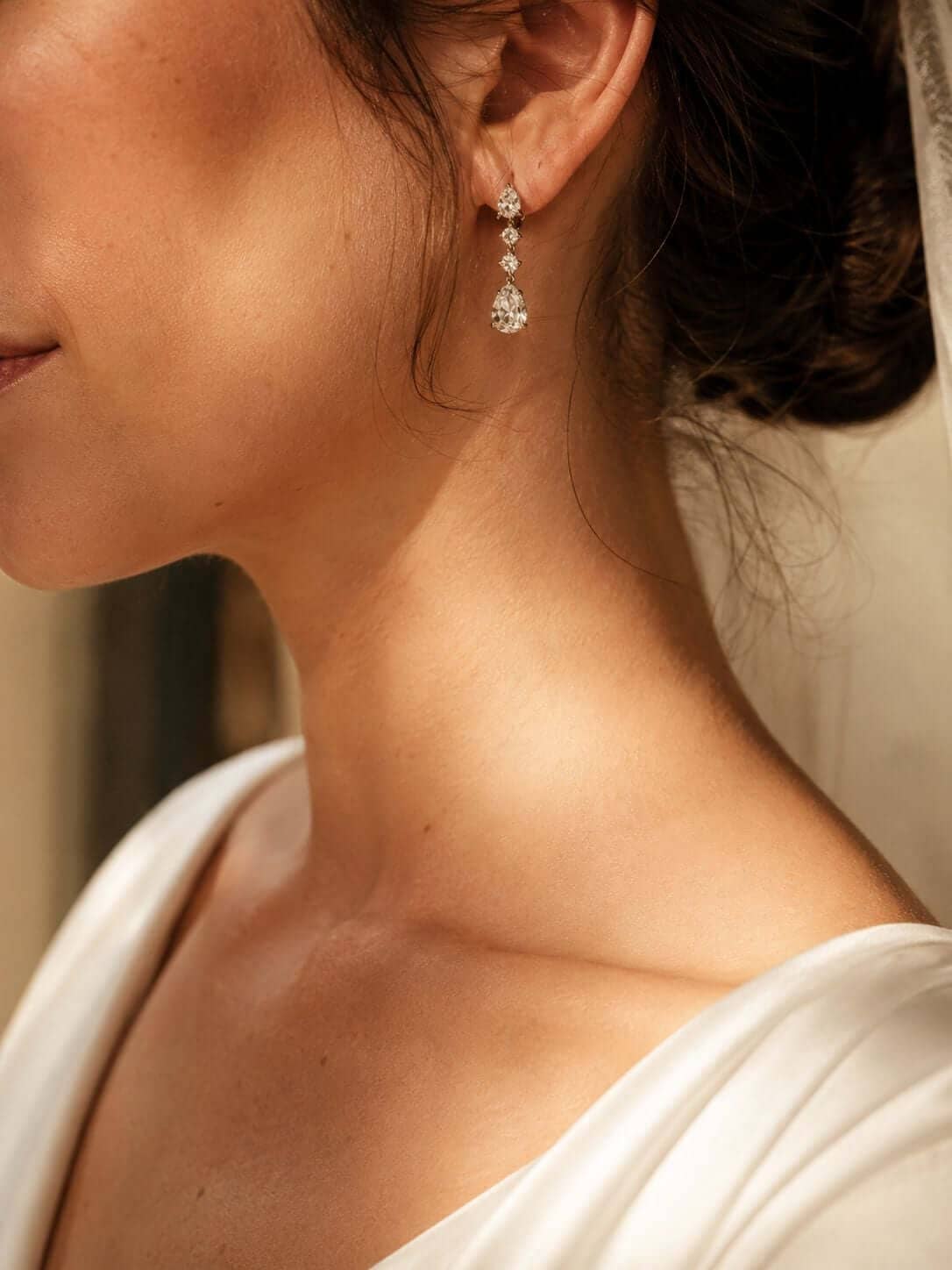 Bride wearing elegant diamond earrings