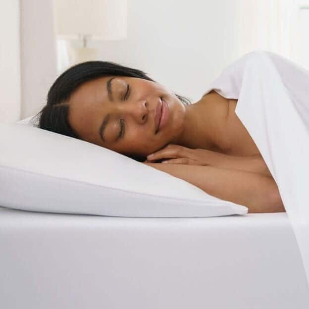 Woman Peacefully Sleeping with Temperature Regulating Sheets in the Wintertime