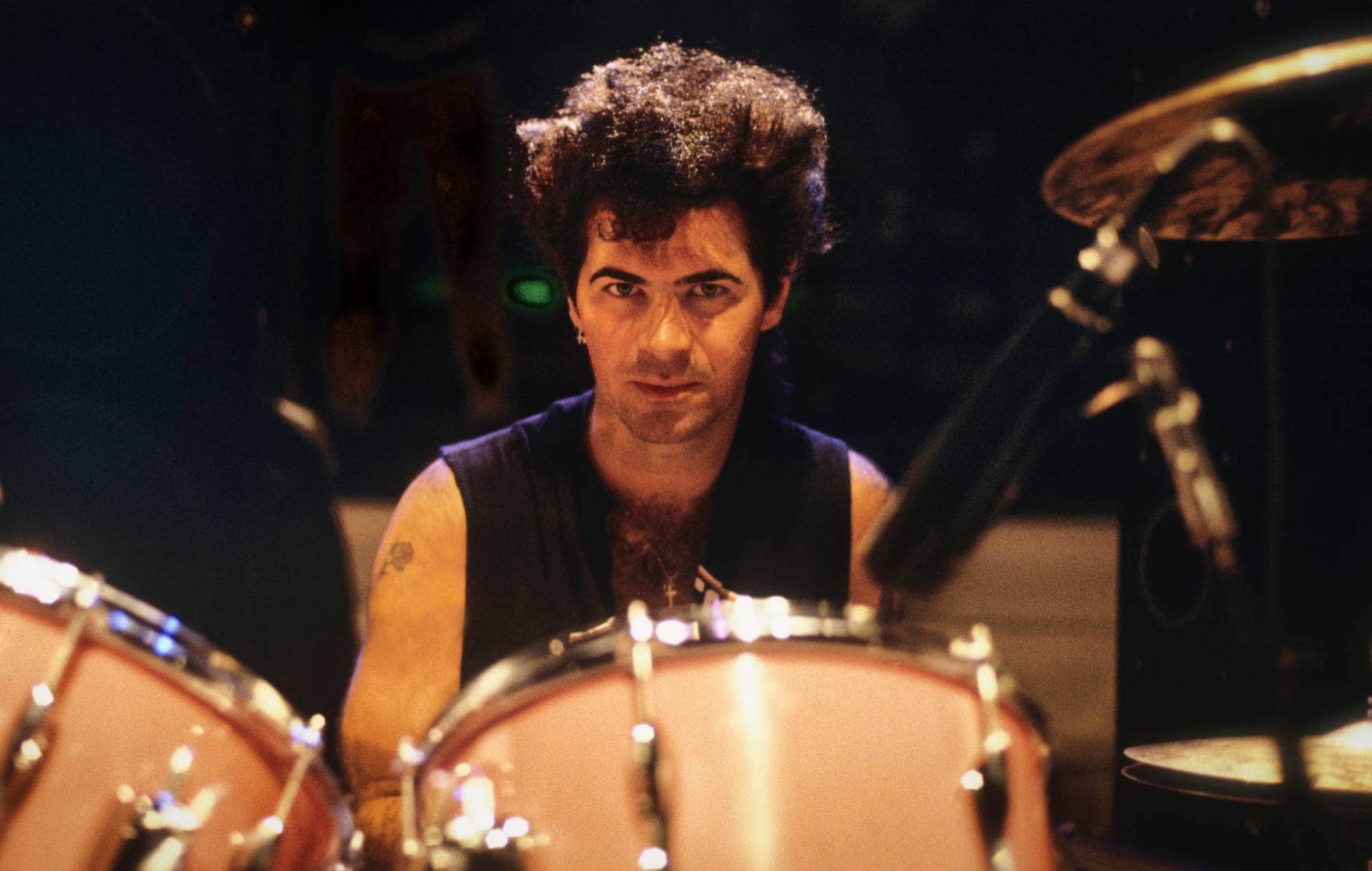 Thommy Price behind the drum kit, a true powerhouse of rock rhythm.