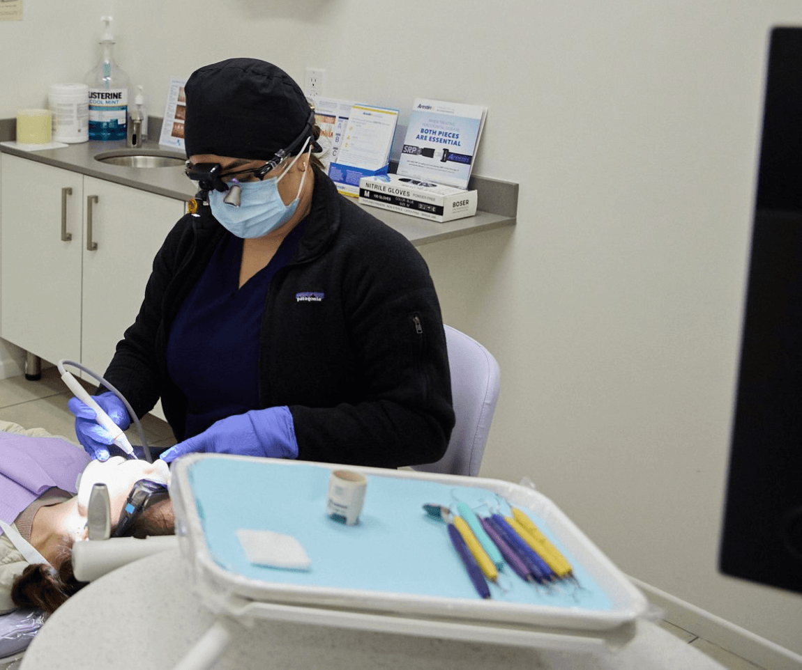 A dentist working on a patient