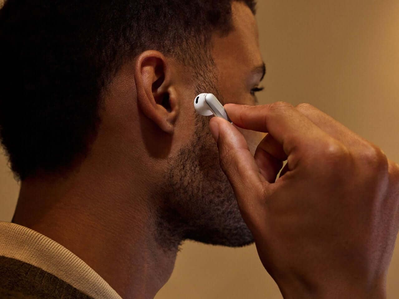 Plaud One AI earbuds shown in a polished product composition