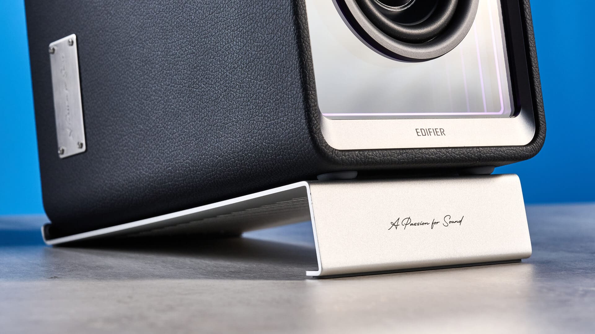 Edifier QR65 speakers on a sleek gaming desk