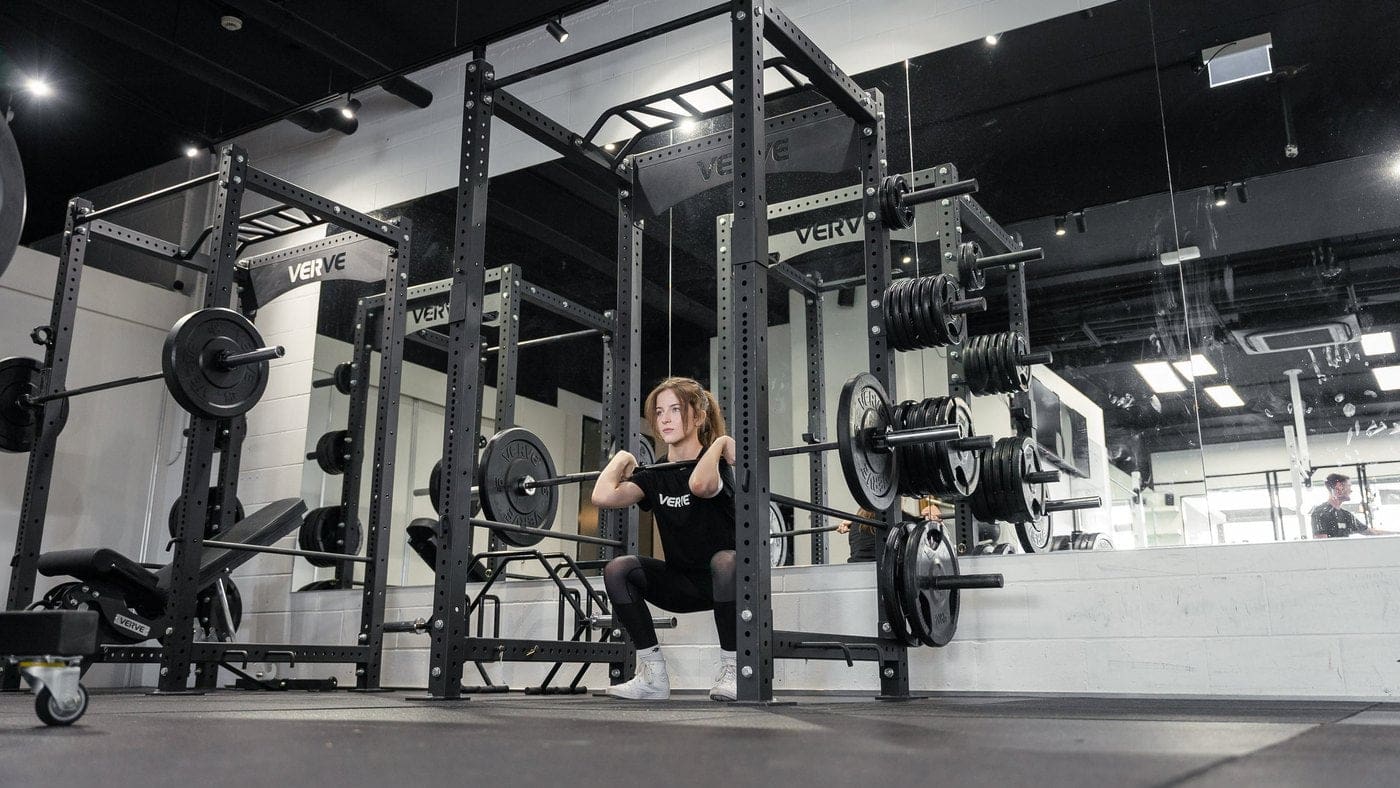 Squatting in a VERVE Zen Power Rack at Cali Studio