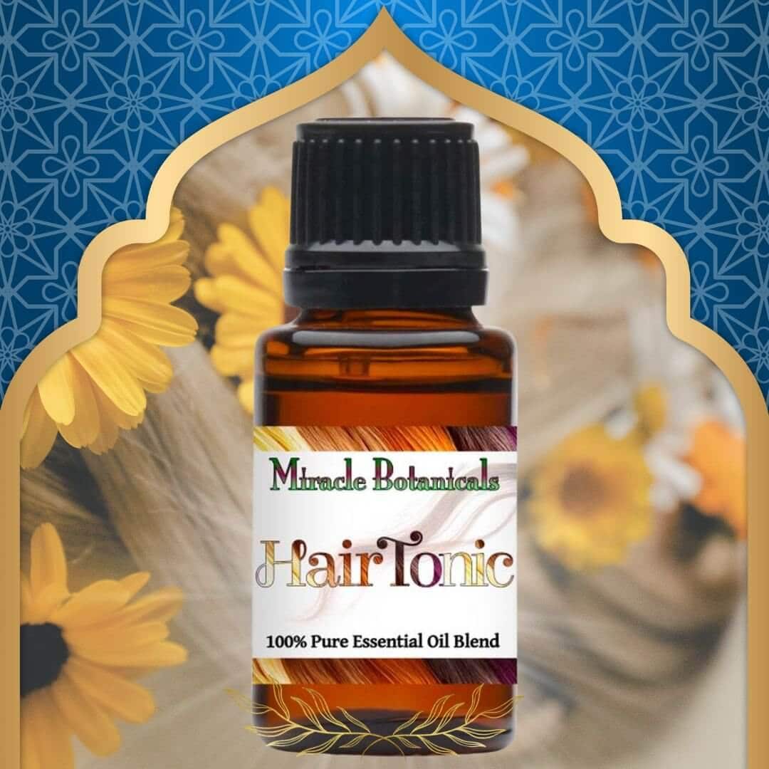 bottle of Hair Tonic essential oil blend by Miracle Botanicals, in front of beautiful blond hair with flowers in it