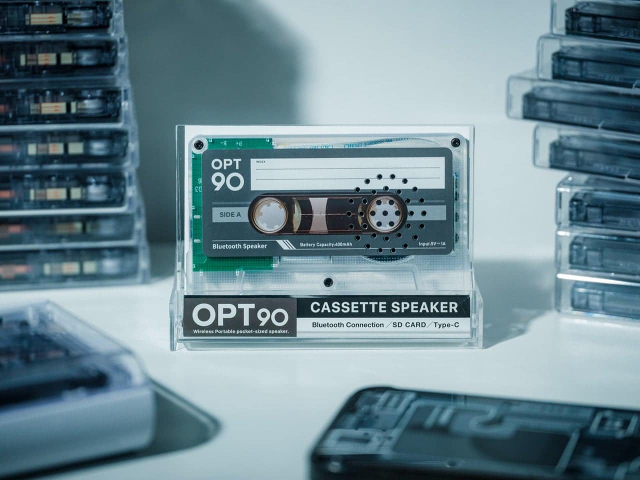 Transparent cassette-shaped Side A speaker with retro graphics