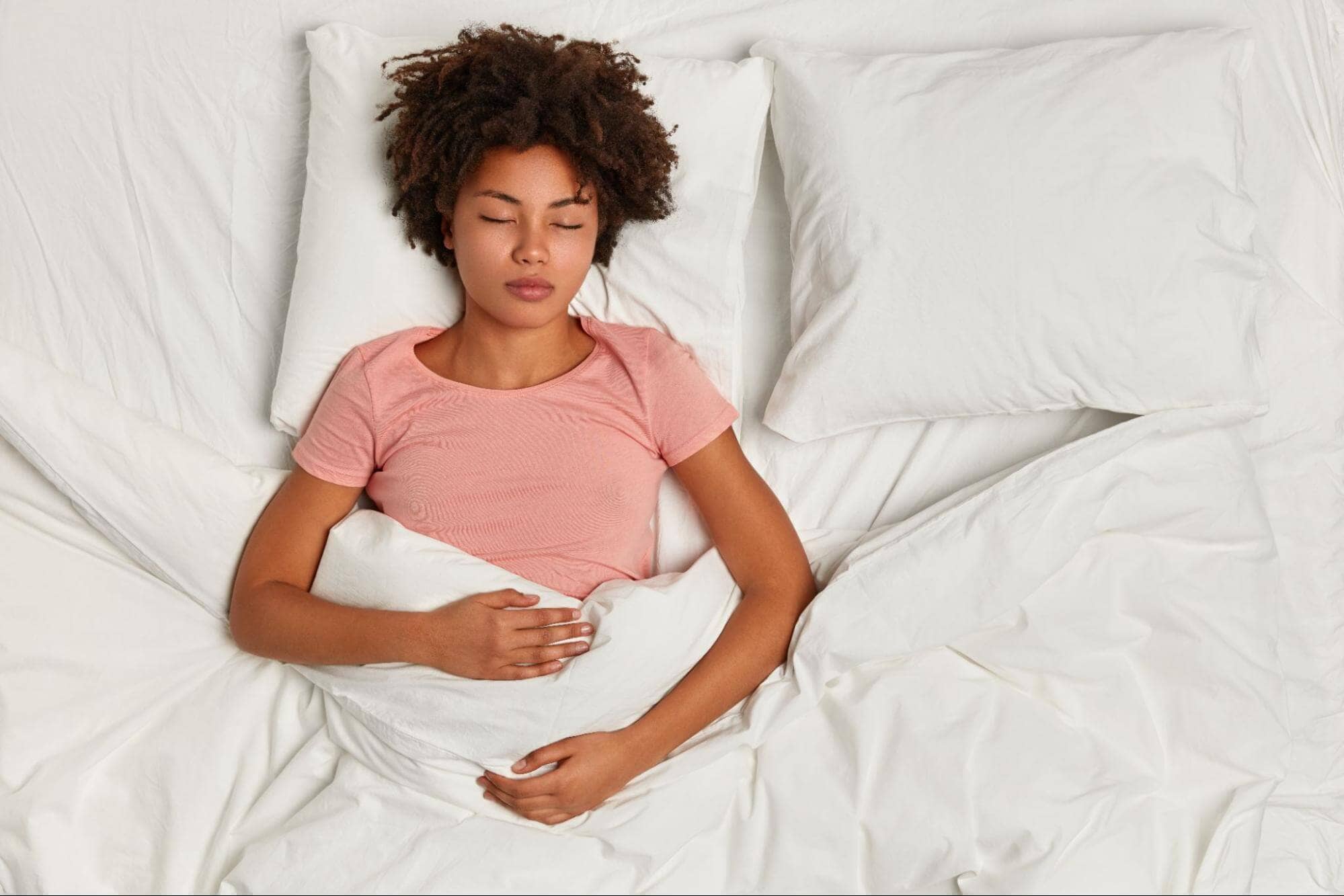 young woman sleeping in bed