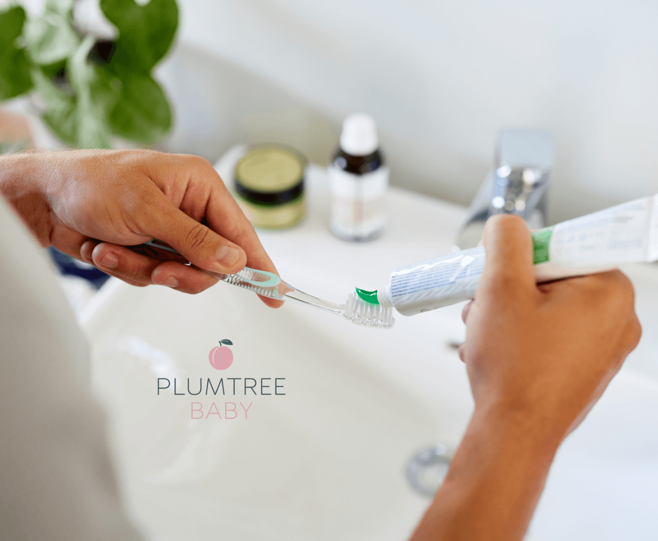woman putting toothpaste on a toothbrush to practice good oral hygiene