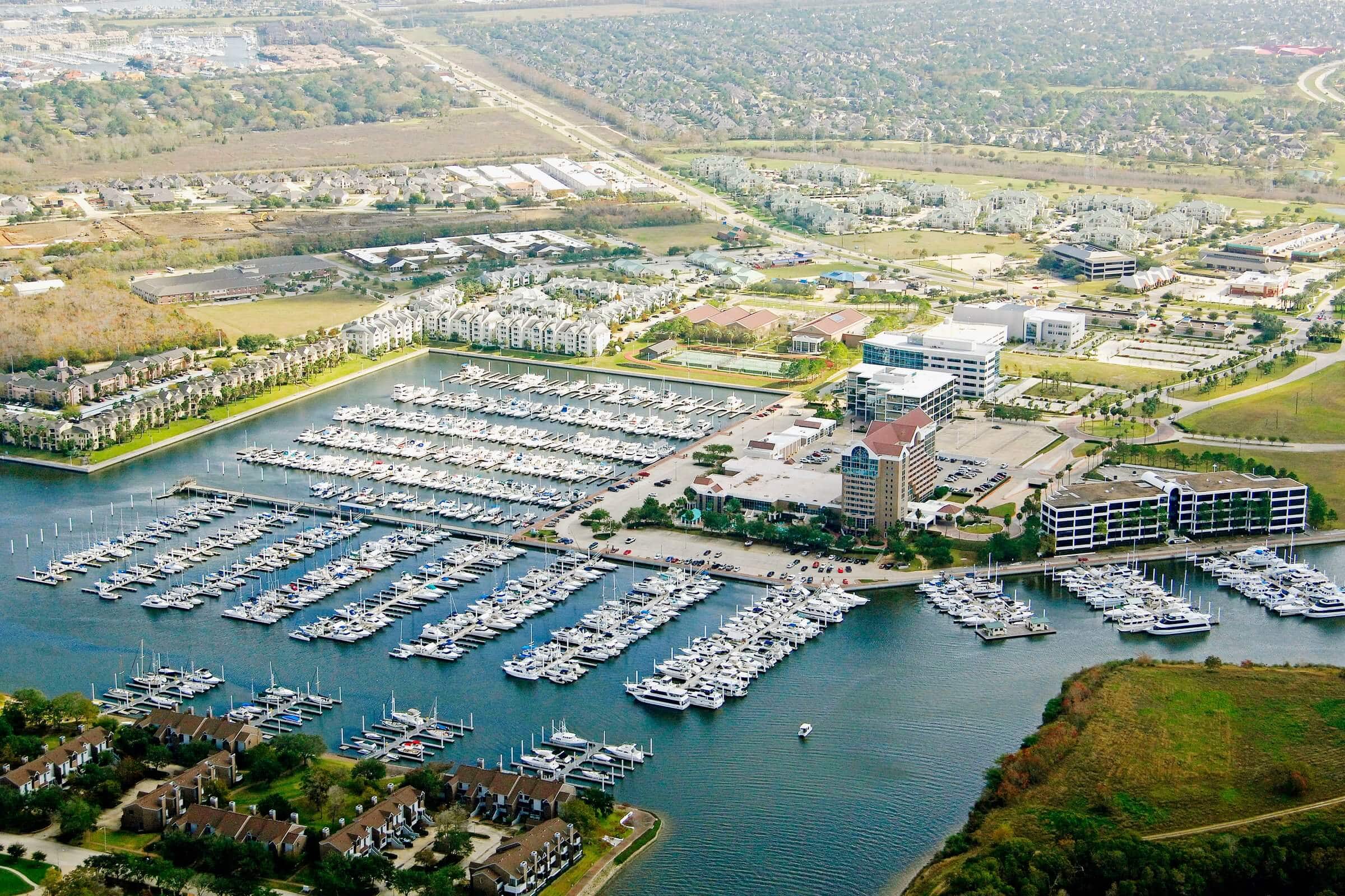 Aerial view of League City TX showing residential neighborhoods and parks for families living in League City TX