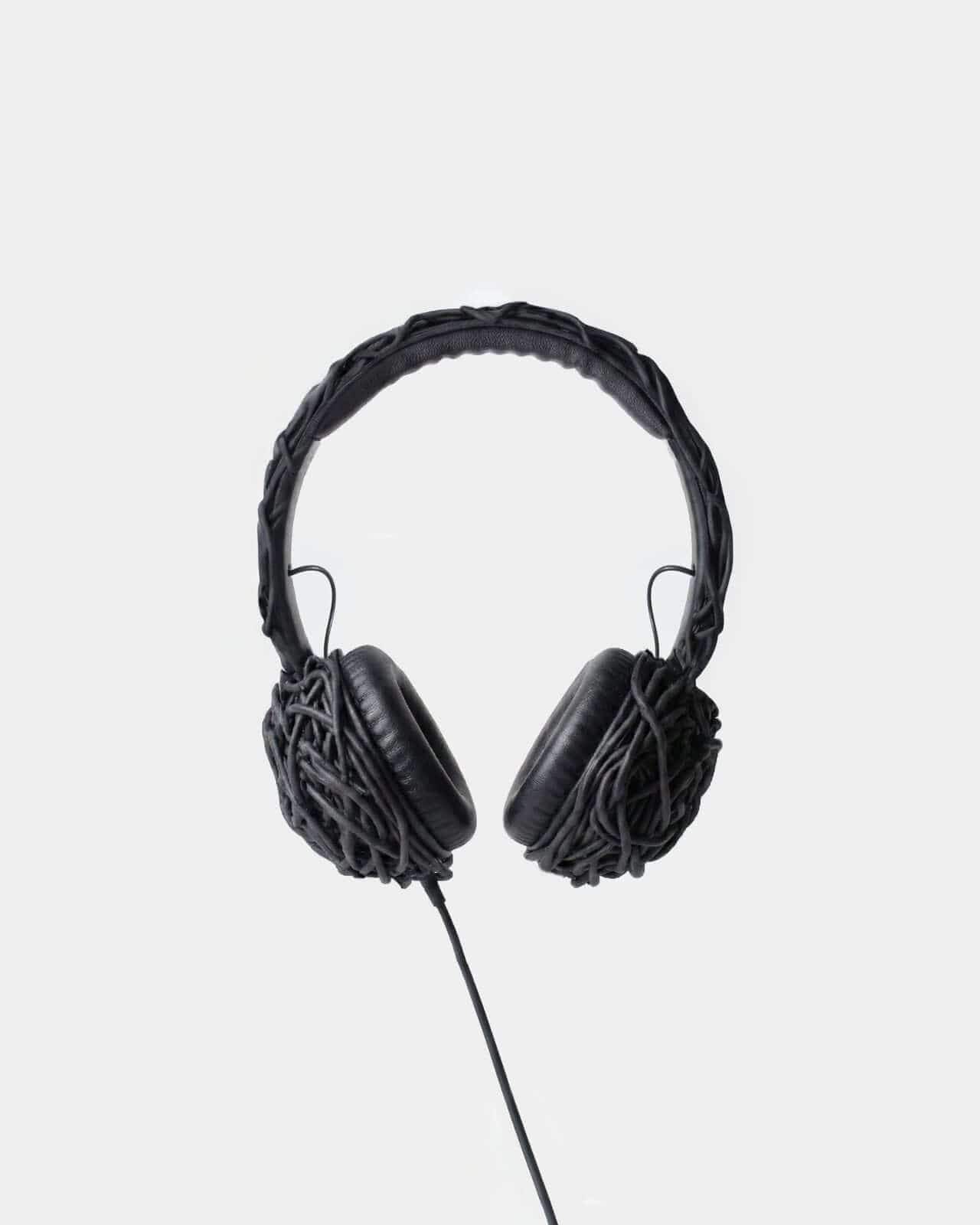 The tangled wire embraces the entire headphone, making the mess the message