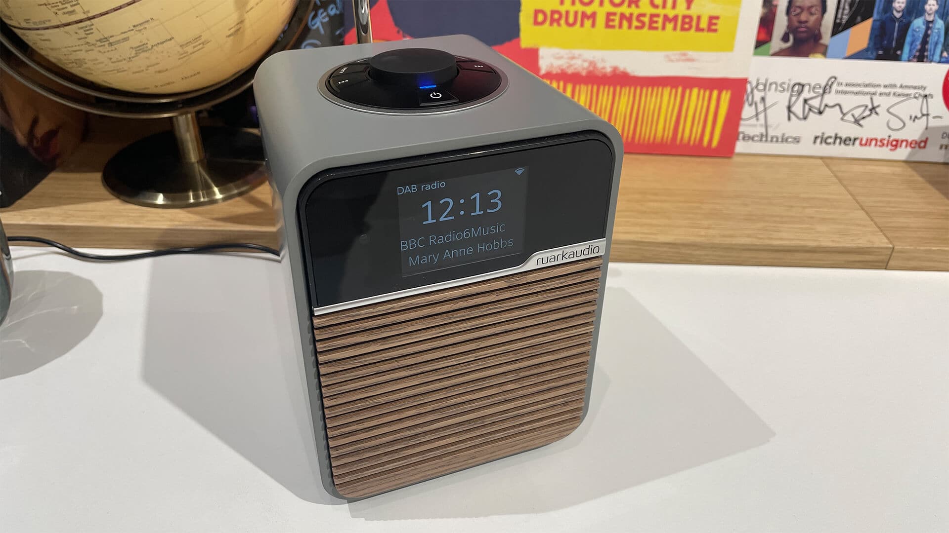 The Ruark Audio R1S elegantly displayed on a white shelf