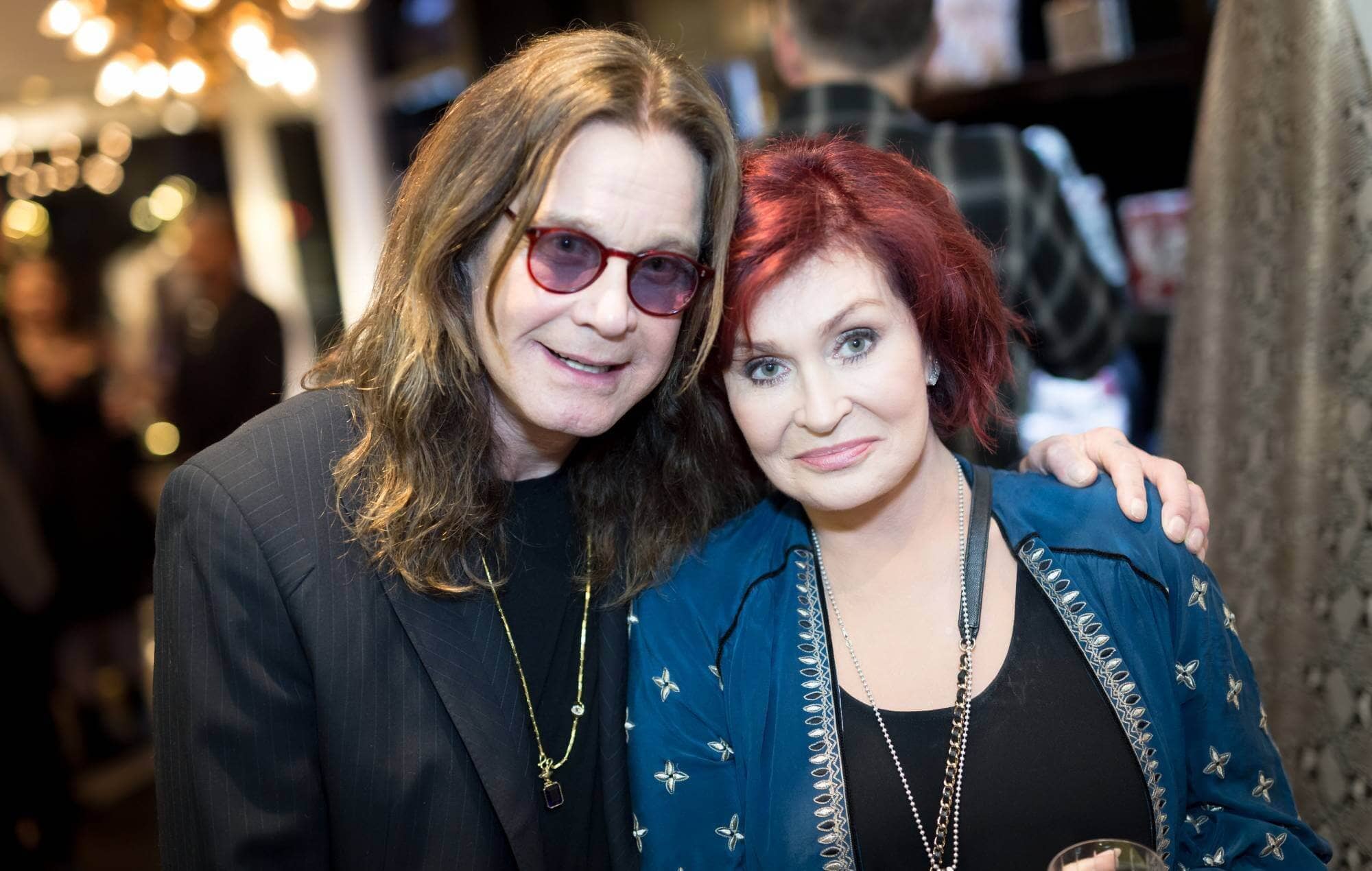 Sharon and Ozzy Osbourne at an event, showing their iconic rockstar presence